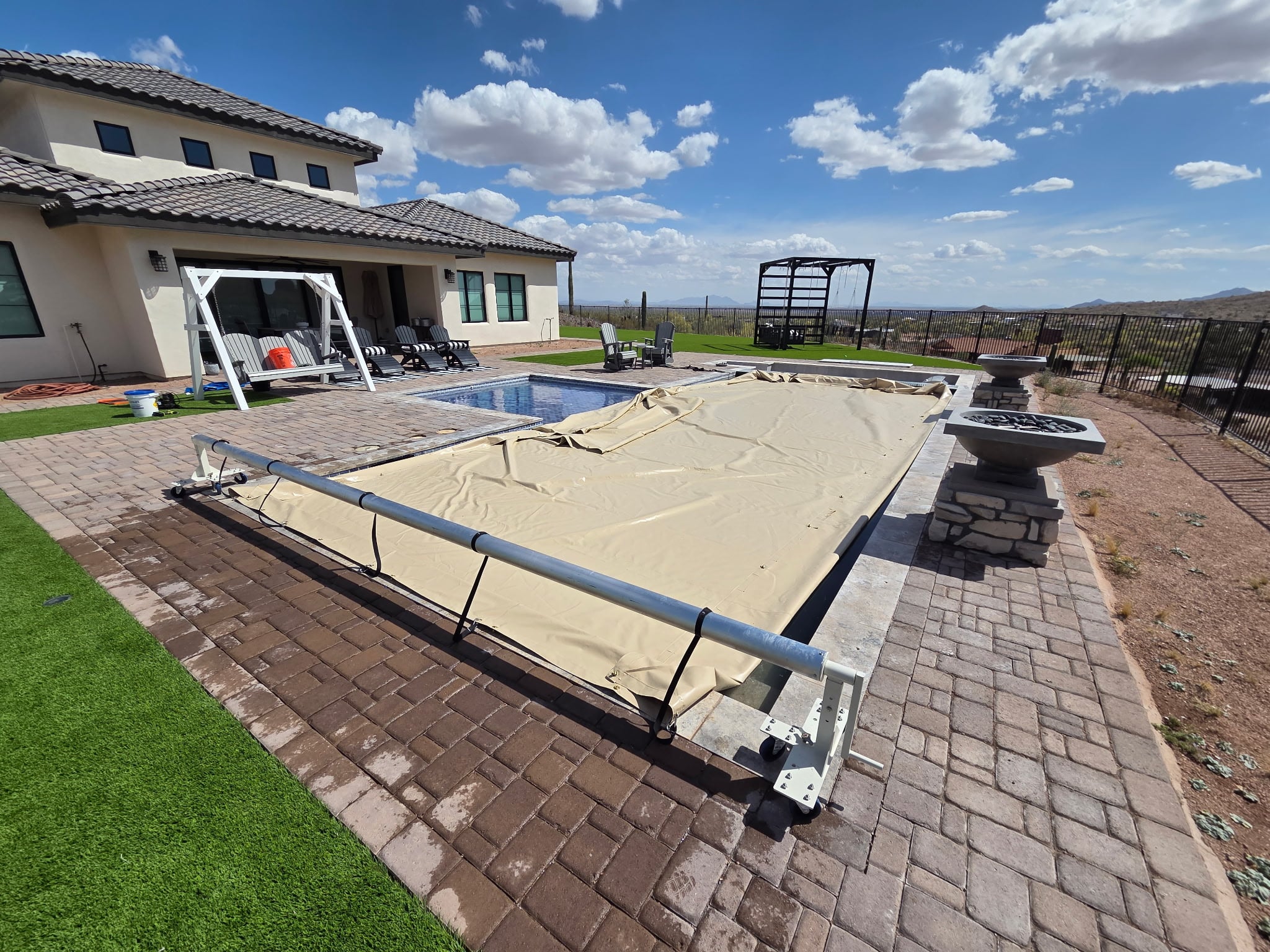 Stainless steel Heavy Duty Roller bolted to the pool deck